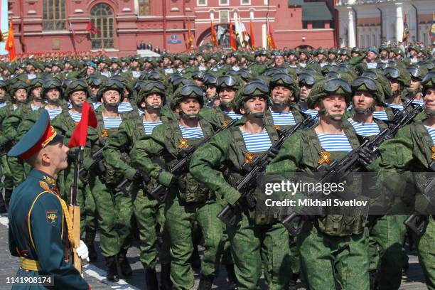 Russian paratroopers march during the main rehearsals of the military parade at Red Square, in front of the Kremlin, on May 7, 2019 in Moscow,...