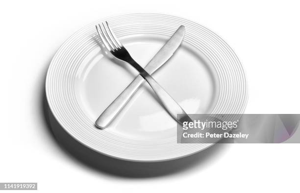 fasting diet - empty plate stock pictures, royalty-free photos & images