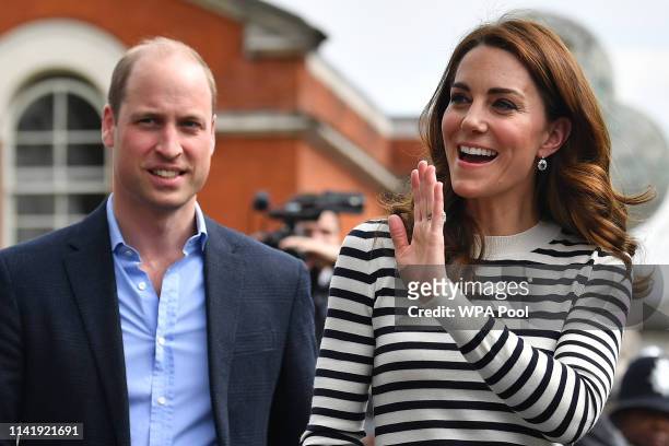 Catherine, Duchess of Cambridge and Prince William, Duke of Cambridge wave to well wishers as they leave after attending the launch of the King's Cup...