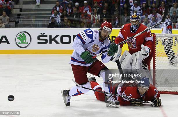 Zbynek Michalek of Czech Republic and Alexander Radulov of Russia battle for the puck during the IIHF World Championship bronze medal match between...