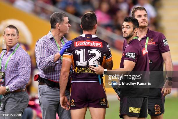 Matt Gillett of the Broncos is seen to by medical staff during the round five NRL match between the Brisbane Broncos and the Wests Tigers at Suncorp...