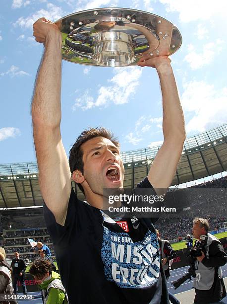 Andre Mijatovic of Berlin poses with the trophy after winning the championship after the Second Bundesliga match between Hertha BSC Berlin and FC...