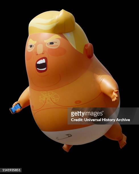 During an official visit to the United Kingdom by President of the United States Donald Trump, an inflatable caricature of Trump was flown in protest...