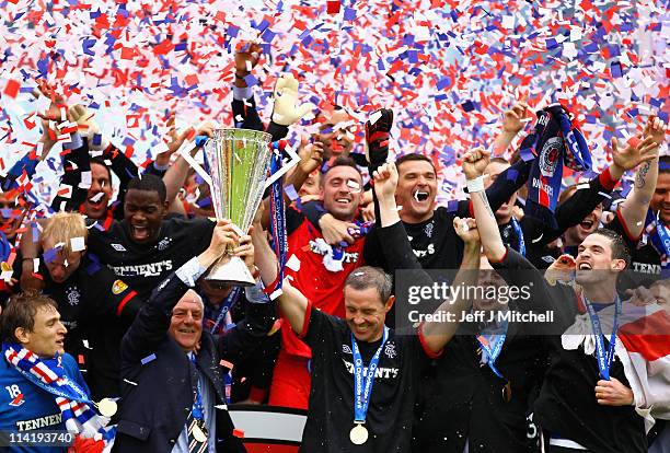 Manager, Walter Smith and David Weir of Rangers lift the Scottish Premier League trophy after winning the Clydesdale Bank Premier League at Rugby...