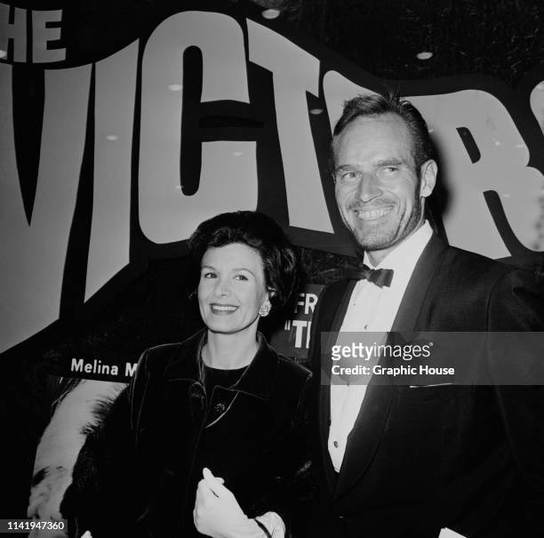 American actor and political activist Charlton Heston and American actress and photographer Lydia Clarke at the US premiere of 'The Victors', New...