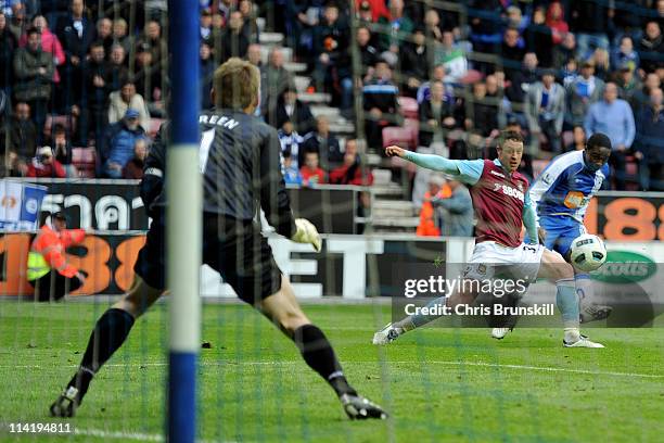 Charles N'Zogbia of Wigan Athletic scores his team's third goal during the Barclays Premier League match between Wigan Athletic and West Ham United...