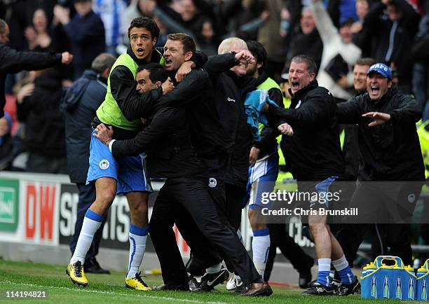 Wigan Athletic Manager Roberto Martinez celebrates after Charles N'Zogbia scored his team's third goal during the Barclays Premier League match...