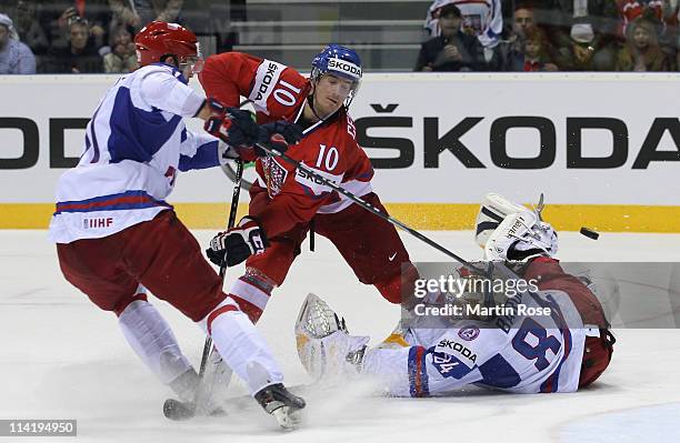 Roman Cervenka of Czech Republic scores his team's 4th goal over Konstantin Barulin , goaltender of Russia during the IIHF World Championship bronze...