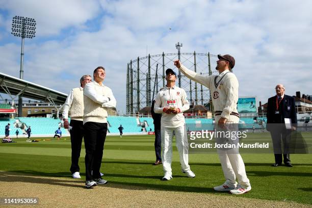 Surrey Captain performs the toss with Essex Captain Ryan ten Doeschate ahead of the start of day one of the Specsavers County Championship Division 1...
