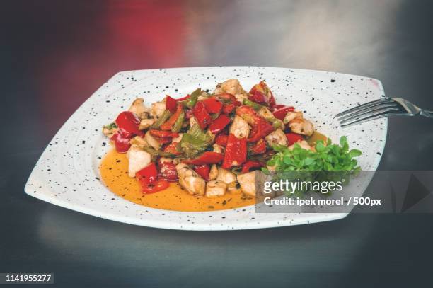 meal with roasted vegetables and chicken meat in small pieces - ipek morel stock pictures, royalty-free photos & images