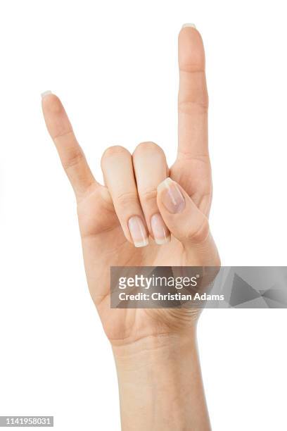 hand sign rock and roll - rockmusik stock-fotos und bilder
