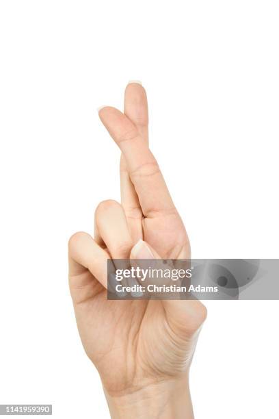 hand sign fingers crossed - finger kreuzen stock-fotos und bilder