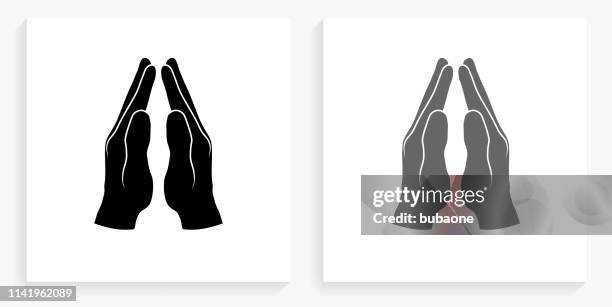 praying hands black and white square icon - praying hands white background stock illustrations