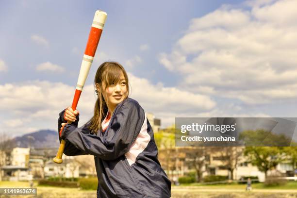 pretty woman with baseball bat - japanese baseball players strike stock pictures, royalty-free photos & images