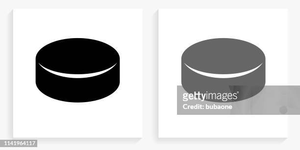 hockey puck black and white square icon - hockey puck stock illustrations