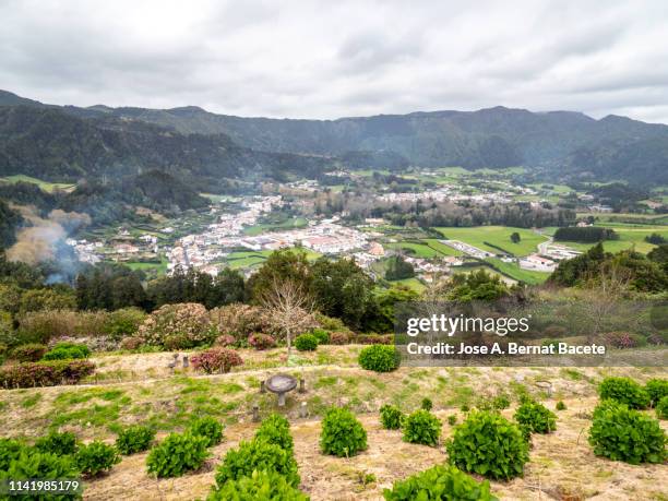 landscape, valley and town of furnas. sao miguel island, azores islands, portugal. - furnas valley stock pictures, royalty-free photos & images