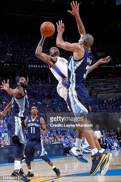 Kevin Durant of the Oklahoma City Thunder shoots against Shane Battier of the Memphis Grizzlies in Game Seven of the Western Conference Semifinals...