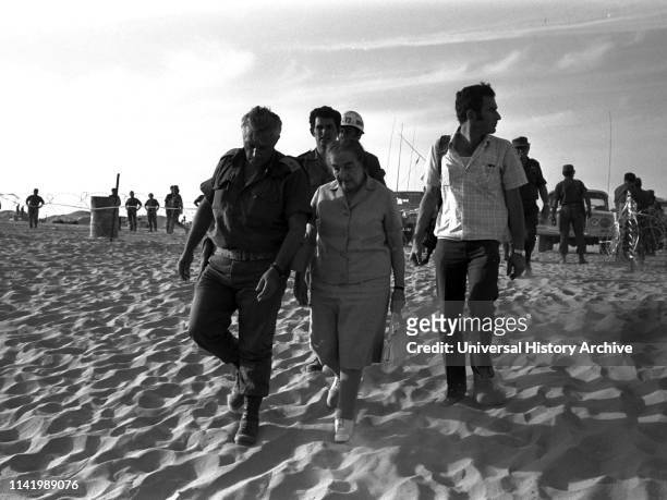 Visiting Israeli positions in the Sinai during the 1973 Arab-Israel War: Israeli Prime Minister Golda Meir with Ariel Sharon , Then a senior Israeli...