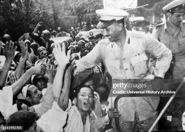 Free officers leaders including Anwar Sadat are mobbed by crowds during the 1952 Egyptian Revolution. Muhammad Anwar el-Sadat , President of Egypt,...