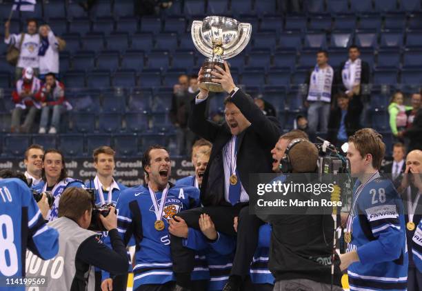 Jukka Jalonen, headcoach of Finland lifts the trophy after winning the IIHF World Championship gold medal match between Sweden and Finland at Orange...