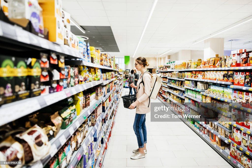 Supermarket Aisle With People Grocery Shopping