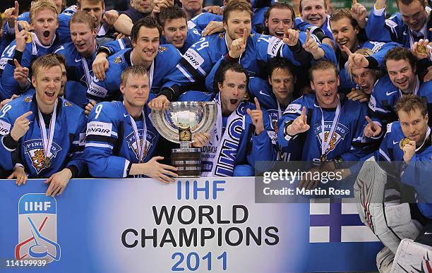 The team of Finland pose for a photo after winning the IIHF World Championship gold medal match between Sweden and Finland at Orange Arena on May 15,...