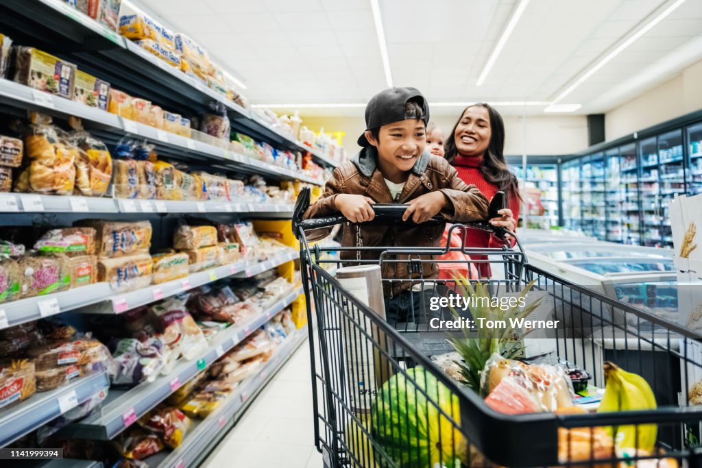 Family Having Fun While Out Buying Groceries.