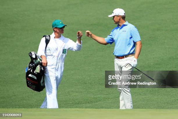 Patton Kizzire of the United States celebrates with caddie Phillip Mollica after making an eagle on the second green during the first round of the...