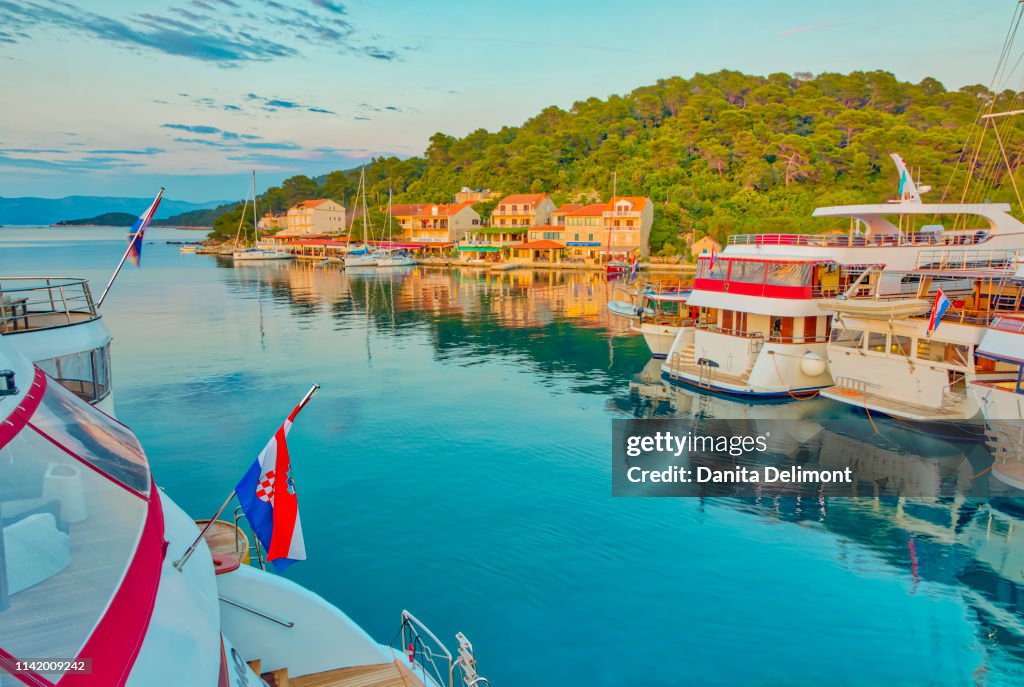 Govedari Sunset On Harbor And Island Of Miljet Pomena Croatia High-Res Stock ...