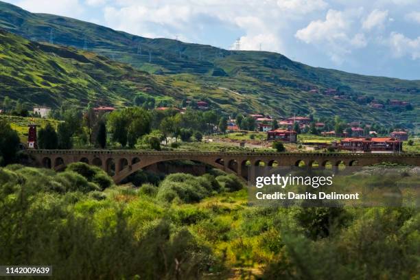 mountain landscape with village and bridge, luhuo, garze tibetan autonomous prefecture, sichuan province, china - sichuan province stock pictures, royalty-free photos & images