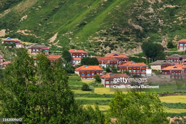 mountain landscape with village, luhuo, garze tibetan autonomous prefecture, sichuan province, china - sichuan province stock pictures, royalty-free photos & images