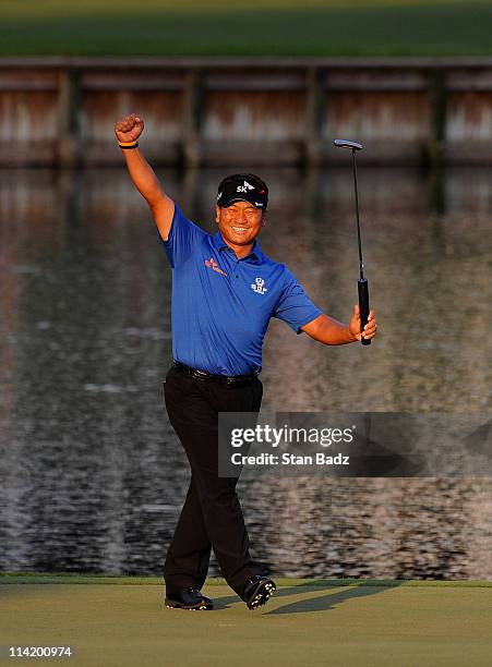 Choi of South Korea celebrates after making a par-saving putt to defeat David Toms on the first playoff hole during the final round of THE PLAYERS...