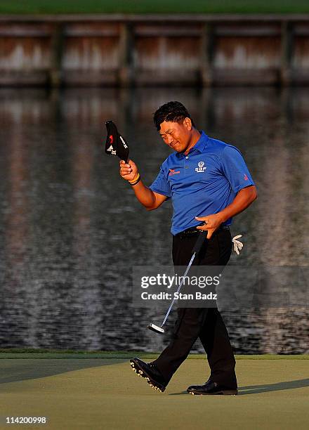 Choi of South Korea celebrates after making a par-saving putt to defeat David Toms on the first playoff hole during the final round of THE PLAYERS...