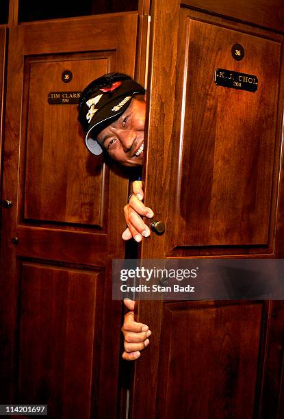 Choi of Korea peers out from his new locker in the Champions locker room after the final round of THE PLAYERS Championship on THE PLAYERS Stadium...