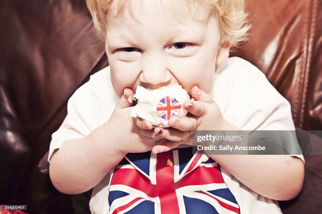 Child eating a Union Jack cupcake