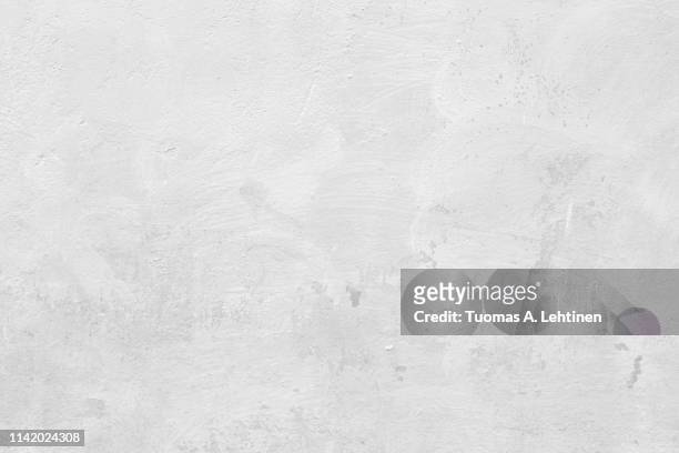 closeup of a white concrete wall - concrete stock photos et images de collection