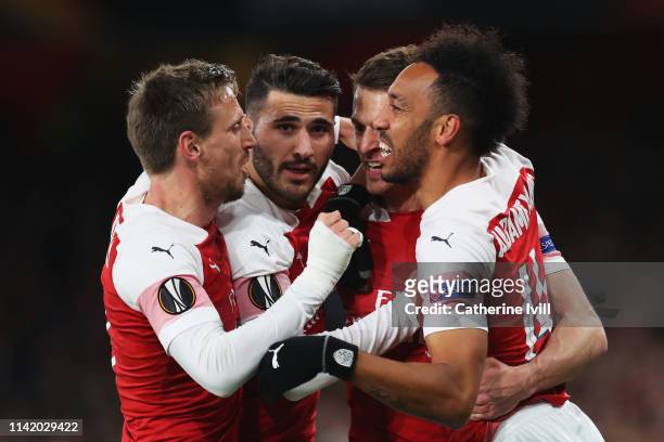 Aaron Ramsey of Arsenal celebrates scoring his teams first goal of the game with team mates Nacho Monreal, Sead Kolasinac and Pierre-Emerick...