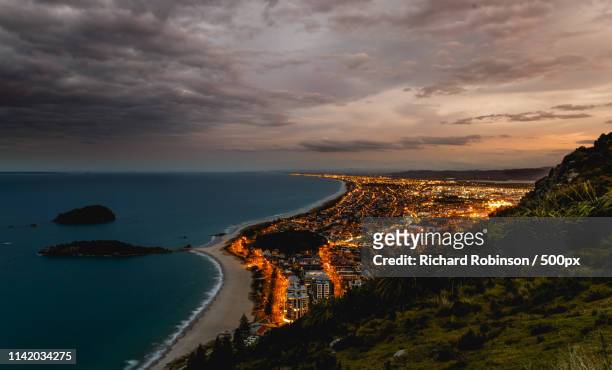 long exposure on top of mount maunganui after sunset - mount maunganui stock pictures, royalty-free photos & images