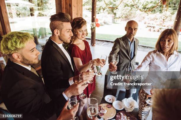 champagne toasting celebration at the gay wedding - colleague engagement stock pictures, royalty-free photos & images