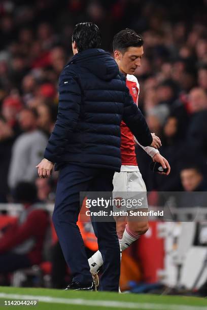 Arsenal Manager, Unai Emery substitutes Mesut Ozil during the UEFA Europa League Quarter Final First Leg match between Arsenal and S.S.C. Napoli at...