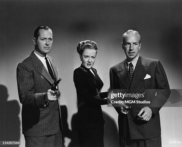 Robert Montgomery , Audrey Totter and Lloyd Nolan in a publicity still for 'Lady In The Lake', which Montgomery also directed, 1947.