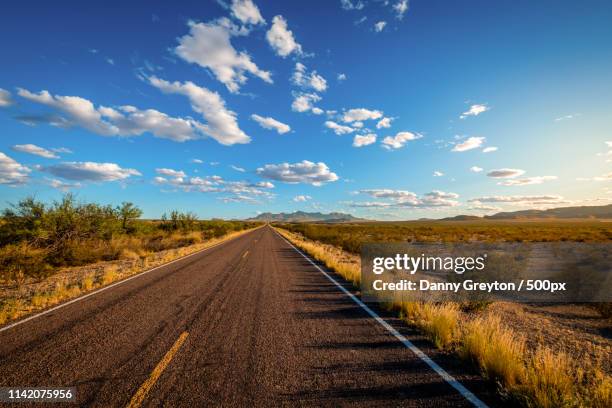 on the road again - texas road stock pictures, royalty-free photos & images