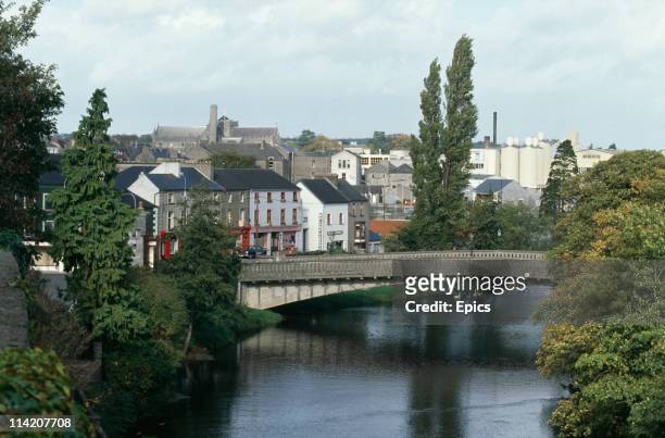 Bridge over the River Nore, seen from Kilkenny Castle in Kilkenny, County Kilkenny, Ireland, circa 1985. St Canice's Cathedral is visible in the...