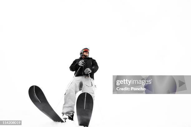 skier standing on the edge - skiing and snowboarding stock pictures, royalty-free photos & images