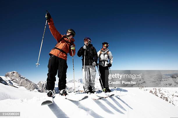 group of skier standing - friends skiing stock pictures, royalty-free photos & images