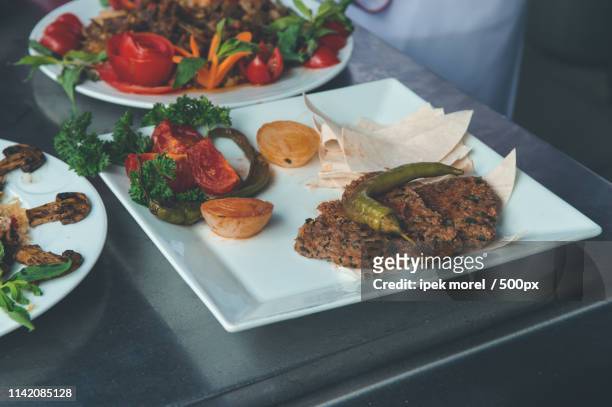 turkish paper kebab (kagit kebap) served in a white plate - ipek morel stock pictures, royalty-free photos & images