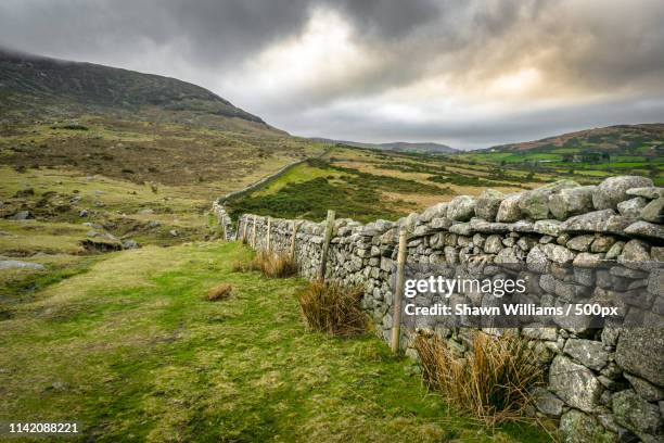 the endless stone wall - county down stock pictures, royalty-free photos & images