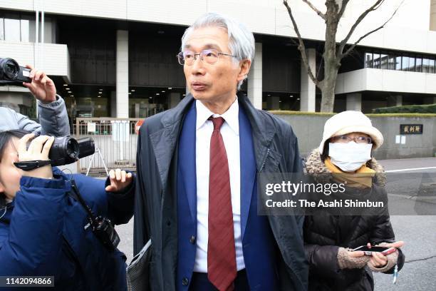 Junichiro Hironaka, lawyer for former Nissan Motor CEO Carlos Ghosn, speaks to media reporters as he leaves the Tokyo District Court after Carole...