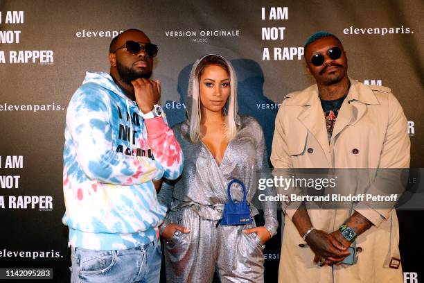 Singer Gims, his wife Demdem and Football player Djibril Cisse attend the "I am not a Rapper" : Capsule Collection Launch Party Photocall on April...