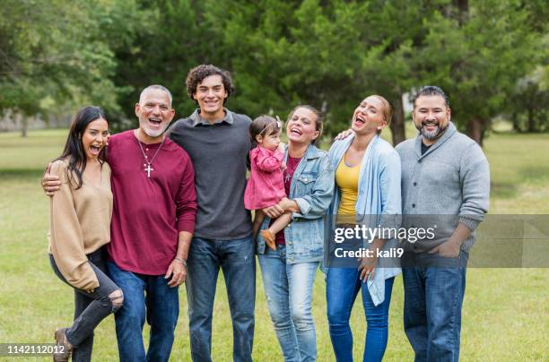 multi-generation hispanic family, reunion at the park - uncle stock pictures, royalty-free photos & images